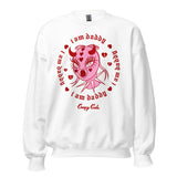 White cotton and polyester unisex crew neck sweat shirt featuring a the head of a femme in a pink latex mask with metal spikes on the neck. Framed within red broken hearts and the phrase “I am daddy”