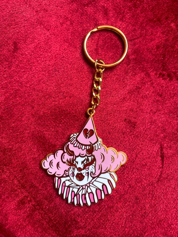 Gold plated keychain featuring a pink and red clown named bimbo 