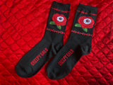 Black unisex size crew socks featuring a red rose with and eye and red Barbwire and chain detail