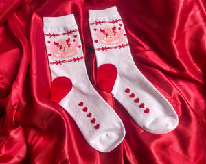 White crew sock with a pink Angel teddy bear and Barbwire and heart designs. Red heart on heel