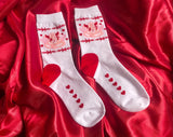 White crew sock with a pink Angel teddy bear and Barbwire and heart designs. Red heart on heel