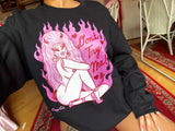 Black cotton and polyester unisex crew neck sweat shirt featuring a sexy 80s lady with horns and big pink hair with the words “Don’t Try Me!” And pink flames in the background 