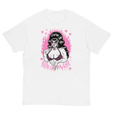 Unisex white cotton short sleeve T-shirt featuring a muscle lady with beehive hair and cat eye sunglasses surrounded by pink broken hearts with the words “Filth is My Life” under her.  Pink flames in the background 