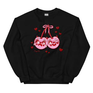 Pink cotton and polyester crew neck sweat shirt featuring pink and red clown cherries with devil horns with one face sad and crying and other happy and winking. The cherries character is surrounded by red hearts