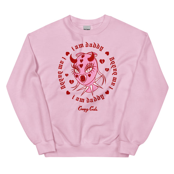 Pink cotton and polyester unisex crew neck sweat shirt featuring a the head of a femme in a pink latex mask with metal spikes on the neck. Framed within red broken hearts and the phrase “I am daddy”