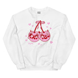 White cotton and polyester unisex crew neck sweat shirt featuring kitschy pink devil cherries with one cherry crying and the other winking. They are tied together with a pink bow and surrounded by pink broken hearts